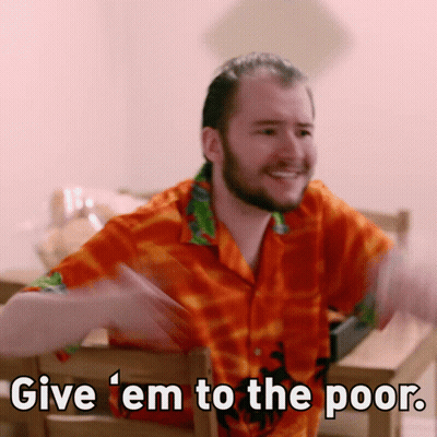 A Man In An Orange Shirt Is Saying Give ' Em To The Poor GIF