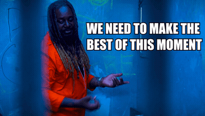 A Man In An Orange Shirt Is Standing In Front Of A Blue Background With The Words We Need To Make The Best Of This Momen GIF