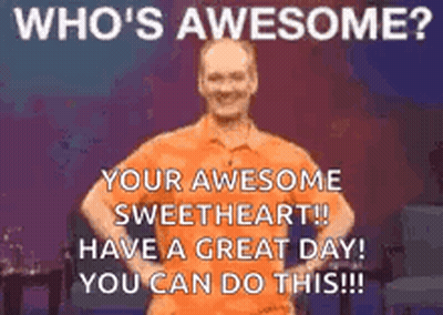 A Man In An Orange Shirt Is Standing On A Stage With His Hands On His Hips And Says `` Who 'S Awesome ? '' GIF