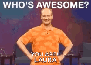 A Man In An Orange Shirt Is Standing With His Hands On His Hips And Says Who 'S Awesome ? You Are ! GIF
