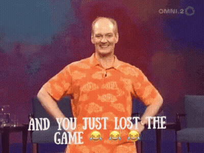 A Man In An Orange Shirt Stands With His Hands On His Hips And Says And You Just Lost The Game GIF