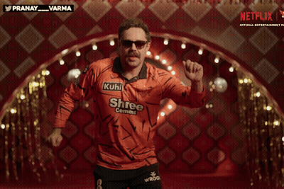 A Man In An Orange Shirt That Says Shree Cement GIF