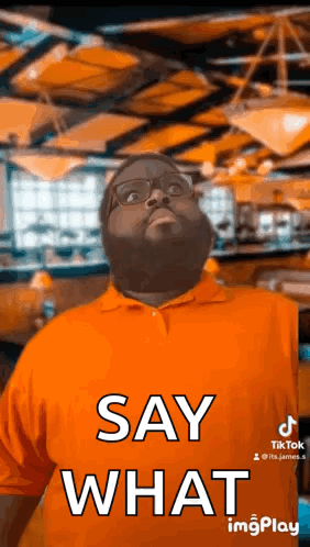 Man In Orange Shirt Saying Say What GIF