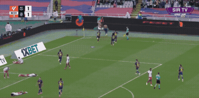 A Man In An Orange Vest That Says Barcelona On It Stands In A Stadium GIF