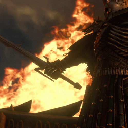 A Man In Armor Holds A Sword In Front Of A Fire And A Sign That Says ' A ' On It GIF