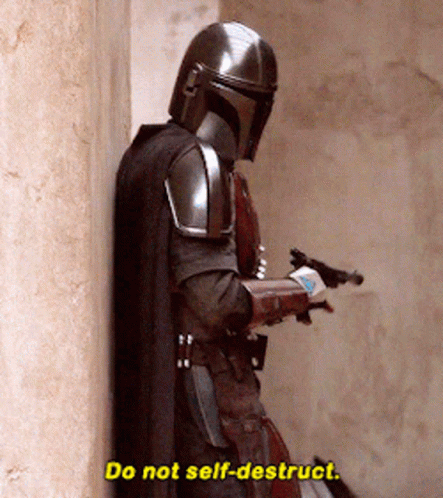A Man In Armor Is Leaning Against A Wall And Saying Do Not Self-Destroy . GIF