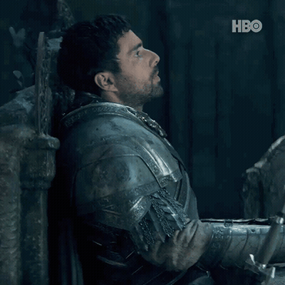 A Man In Armor Is Leaning Against A Wall And The Word No Is On The Bottom GIF
