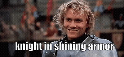 A Man In Armor Is Smiling With The Words `` Knight In Shining Armor '' Written Above Him . GIF