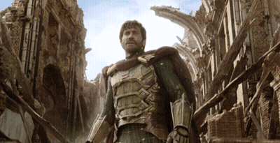A Man In Armor Is Standing In A Ruined Building GIF