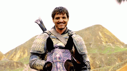 A Man In Armor Riding A Horse With A Sword On His Shoulder GIF