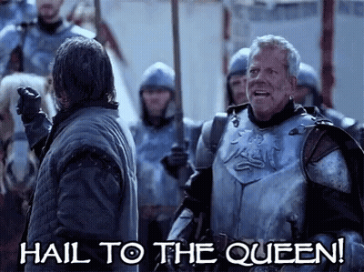 A Man In Armor Says Hail To The Queen While Standing Next To Another Man GIF