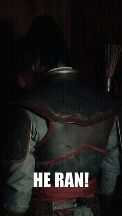 A Man In Armor Says He Ran In Front Of A Dark Background GIF