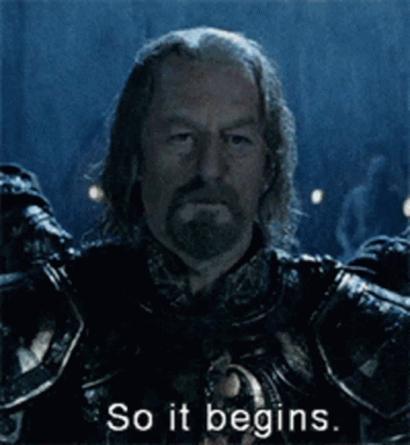 A Man In Armor Says So It Begins In A Dark Room GIF