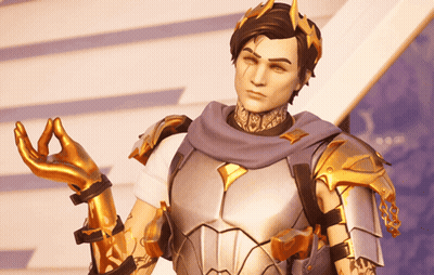 A Man In Armor With A Crown On His Head Is Making A Peace Sign GIF