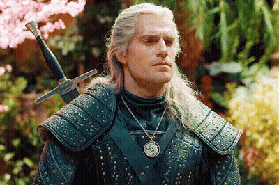 A Man In Armor With A Sword On His Shoulder GIF
