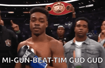 A Man In Boxing Gloves Is Holding A Boxing Championship Belt And Says " Mi-Gun-Beat-Tim Gud Gud " GIF