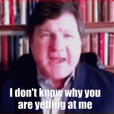 A Man In Front Of A Bookshelf Says I Don T Know Why You Are Yelling At Me GIF