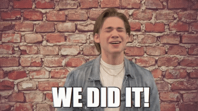 A Man In Front Of A Brick Wall With The Words We Did It On The Bottom GIF