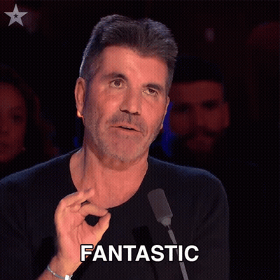 A Man In Front Of A Microphone Has The Word Fantastic Written On His Face GIF