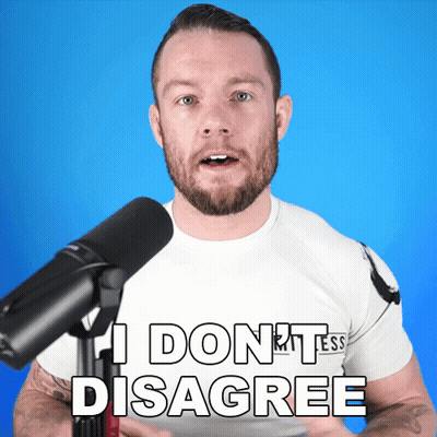 A Man In Front Of A Microphone Says I Don T Disagree GIF