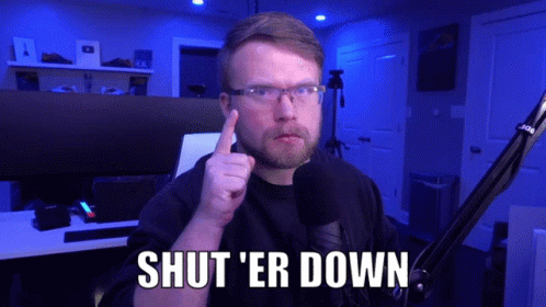 A Man In Front Of A Microphone Says Shut Er Down GIF