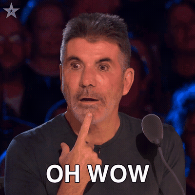 A Man In Front Of A Microphone With His Finger On His Chin And The Words Oh Wow Above Him GIF