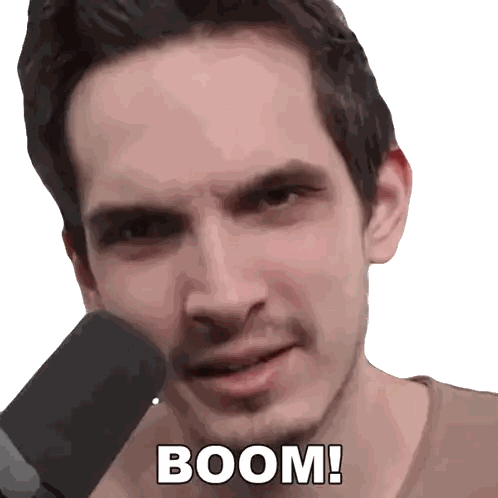 A Man In Front Of A Microphone With The Words Boom On His Face Sticker