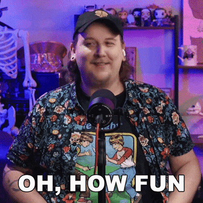 A Man In Front Of A Microphone With The Words Oh How Fun On His Shirt GIF