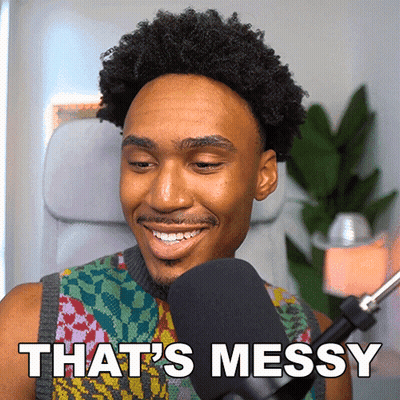 A Man In Front Of A Microphone With The Words That 'S Messy GIF