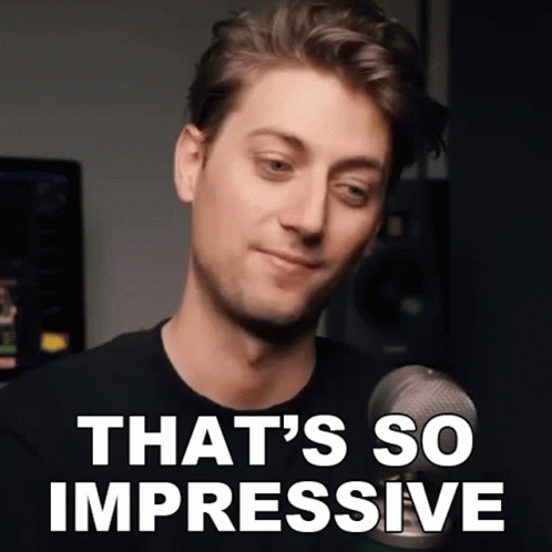 A Man In Front Of A Microphone With The Words That 'S So Impressive On His Face GIF
