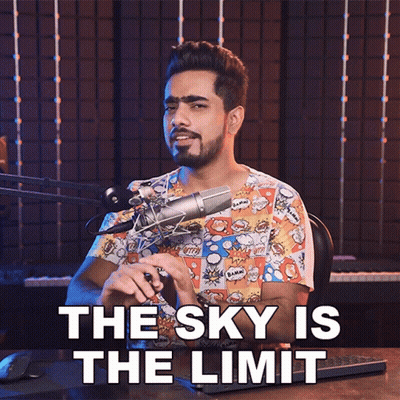 A Man In Front Of A Microphone With The Words The Sky Is The Limit GIF