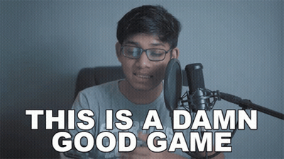 A Man In Front Of A Microphone With The Words This Is A Damn Good Game Above Him GIF