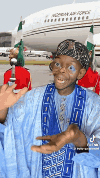 A Man In Front Of A Nigerian Air Force Plane GIF