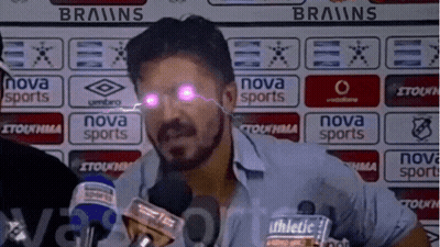 A Man In Front Of A Nova Sports Banner GIF