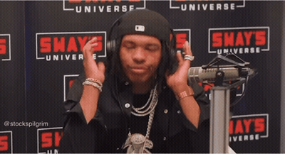 A Man In Front Of A Shaw 'S Universe Sign GIF