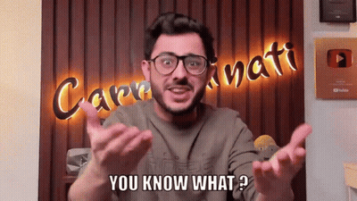 A Man In Front Of A Sign That Says Caprinati GIF