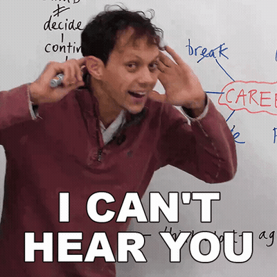 A Man In Front Of A White Board With The Words I Can 'T Hear You Written On It GIF