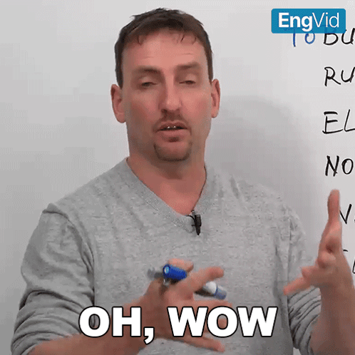 A Man In Front Of A White Board With The Words Oh Wow Written On It GIF