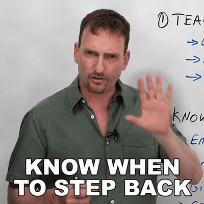 A Man In Front Of A Whiteboard With The Words Know When To Step Back GIF
