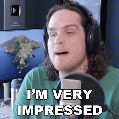 A Man In Headphones Says I 'M Very Impressed GIF