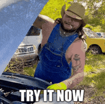 A Man In Overalls And A Cowboy Hat Is Working On A Car With The Words Try It Now Written On The Bottom GIF