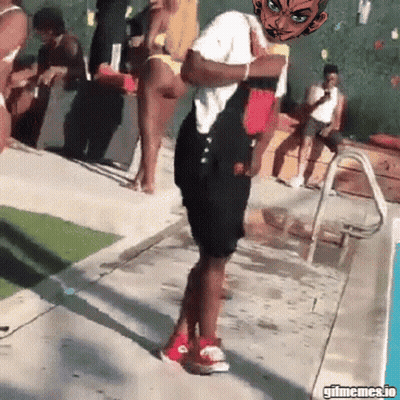 A Man In Overalls Is Standing In Front Of A Pool With A Cartoon Character On His Head GIF