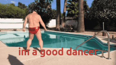 A Man In Red Swim Trunks Is Jumping Into A Swimming Pool With The Words " Im A Good Dancer " Written Below Him GIF
