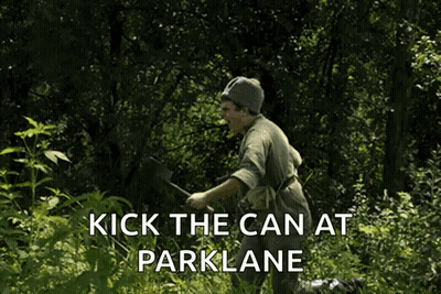 A Man In The Woods With The Words Kick The Can At Parklane On The Bottom GIF