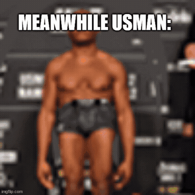 A Man In Underwear Is Standing In Front Of A Sign That Says Meanwhile Usman . GIF