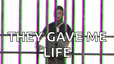 A Man Is Behind Bars With The Words `` They Gave Me Life '' Written Above Him . GIF