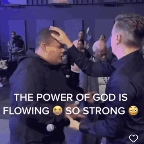 A Man Is Being Blessed By Another Man In A Video That Says " The Power Of God Is Flowing So Strong " GIF