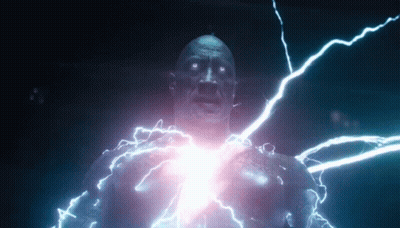 A Man Is Being Struck By Lightning While Standing In A Dark Room . GIF