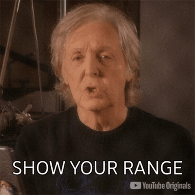 A Man Is Blowing A Kiss With The Caption Show Your Range GIF