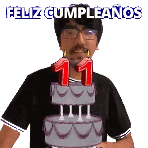 A Man Is Blowing Out Candles On A Cake That Says 11 Sticker
